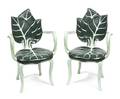 A Pair of Carved and Painted Arm Chairs