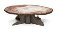 A Fossilized Wood Table Top and Iron XForm Base