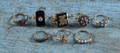 Eight 14K yellow gold rings with various stones