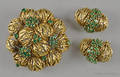 18K yellow gold fur pin and matching earrings with clusters of emeralds