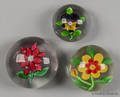 Three single flower paperweights