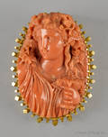 Carved coral cameo brooch