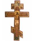 A RUSSIAN SHAPED ICON OF THE CRUCIFIXION 19TH CENTURY