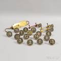 Eighteen Painted Iron Numbered Markers and a Scale