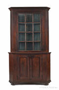 Pennsylvania walnut twopart corner cupboard ca 1800