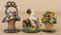 Two cast iron flower basket doorstops