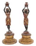 A Pair of Continental Painted Metal Figural Candlesticks