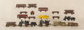 Large group of cast iron small trains and miscellaneous cars