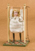 Walther and Sohn bisque head acrobat doll on a wood platform