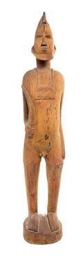 A Senufo Style Carved Wood Male Figure with Sword