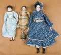 Group of four bisque molded hair dolls