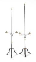 Two contemporary iron and brass candle floor lamps