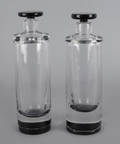 Pair of Orrefors colorless and smoky glass bottles