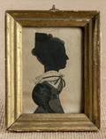 Watercolor and hollowcut silhouette of a woman ca 1830