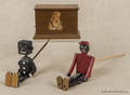 Two black Americana dancing toys