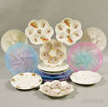 Fourteen Porcelain and Glass Oyster Plates