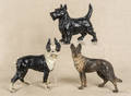 Three cast iron dog doorstops