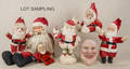 Ten stuffed Santa figures