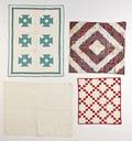 Three patchwork crib quilts