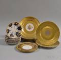 Twenty Gilt Porcelain Dinner and Dessert Plates