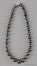 18 strand necklace consisting of 11mm to 14mm cultured Tahitian pearls with a white gold bead clasp and pave set diamonds