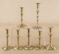 Seven Georgian brass candlesticks