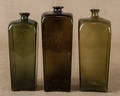 Three blown olive glass gin bottles 19th c