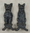 Pair of cast iron dog and cat andirons by Howes