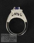 18K white gold ring containing a center round cut blue sapphire