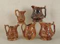 Five Rockingham glaze pitchers