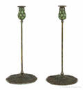 Pair of Arts and Crafts style patinated bronze candlesticks