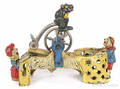 Cast iron  Professor Pug Frogs Great Bicycle Feat  mechanical bank manufactured by J  E Stevens Company