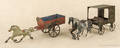 Two early American painted tin horse drawn wagons