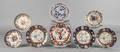 Eleven Gaudy ironstone and Imari palette plates