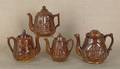 Four Rockingham glaze teapots