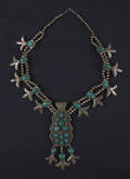 Silver and turquoise squash blossom necklace marked  JT 
