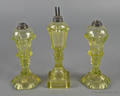 Pair of vaseline sandwich glass fluid lamps ca 1850