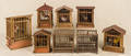 Collection of six German rooster squeak toys in wooden cages