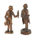 Two carved figures of gentlemen