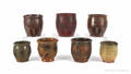 Assembled set of seven Pennsylvania graduated redware crocks 19th c