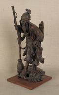 Japanese carved hardwood figure of a fish monger