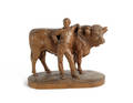 Swiss carved figure of a man and a bull