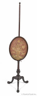 Chippendale style mahogany pole screen with a needlework panel
