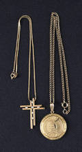 Two 14K yellow gold necklaces and pendants to include a locket and cross pendant with six accent diamonds