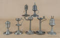 Four American pewter oil lamps