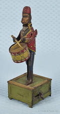 Distler tin windup monkey playing a drum