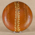 Pennsylvania slip decorated redware plate 19th c