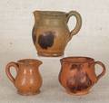 Three Pennsylvania miniature redware pitchers 19th c