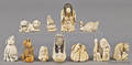 Eleven Japanese carved ivory netsuke