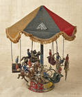 German tin wind up carousel